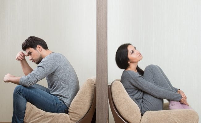 Catching a Cheater. Emotional Distance. guy and girl in separate rooms