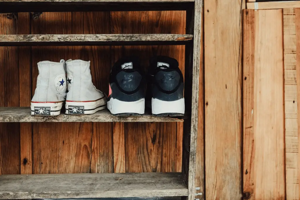 Grey and black sneakers on rack