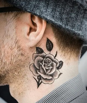 A person with a rose tattoo on his neck showing Minimalist Neck Tattoo
