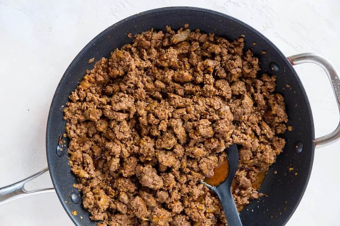 Ground beef on stove to show the look of cooking.  walking noachos