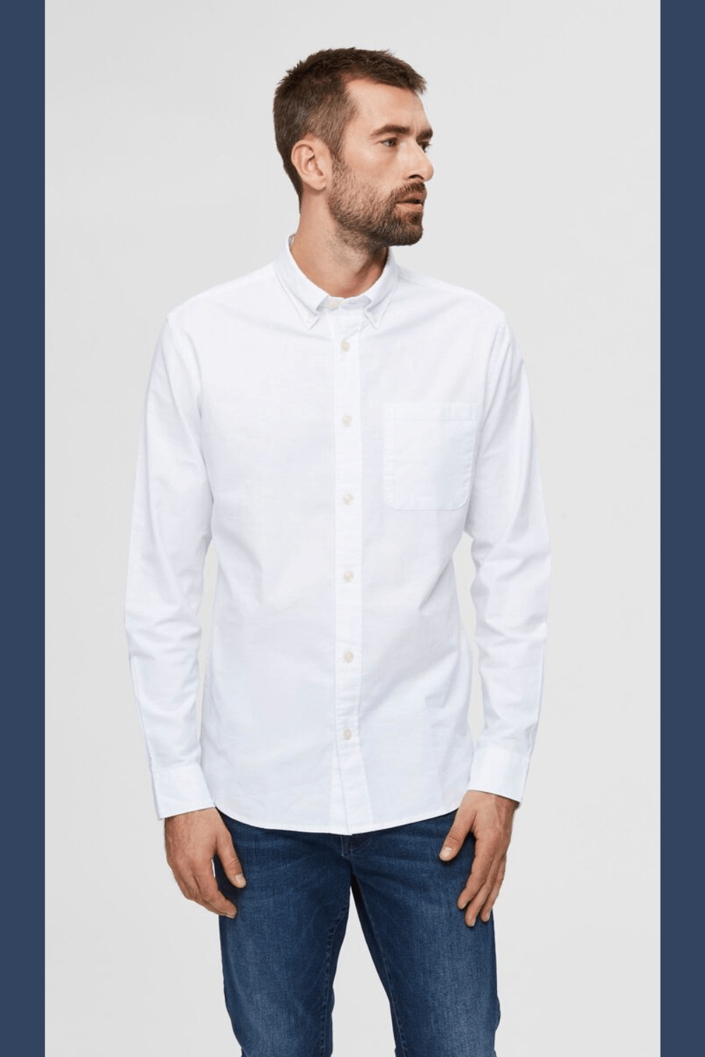 male model in all white cotton button up collar shirt. 