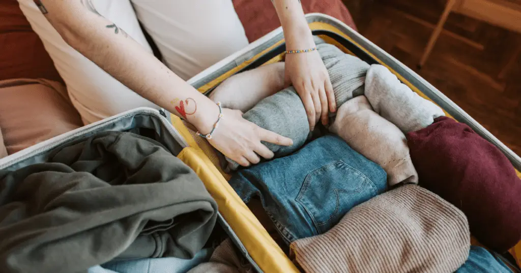 Packing clothes in a suitcase