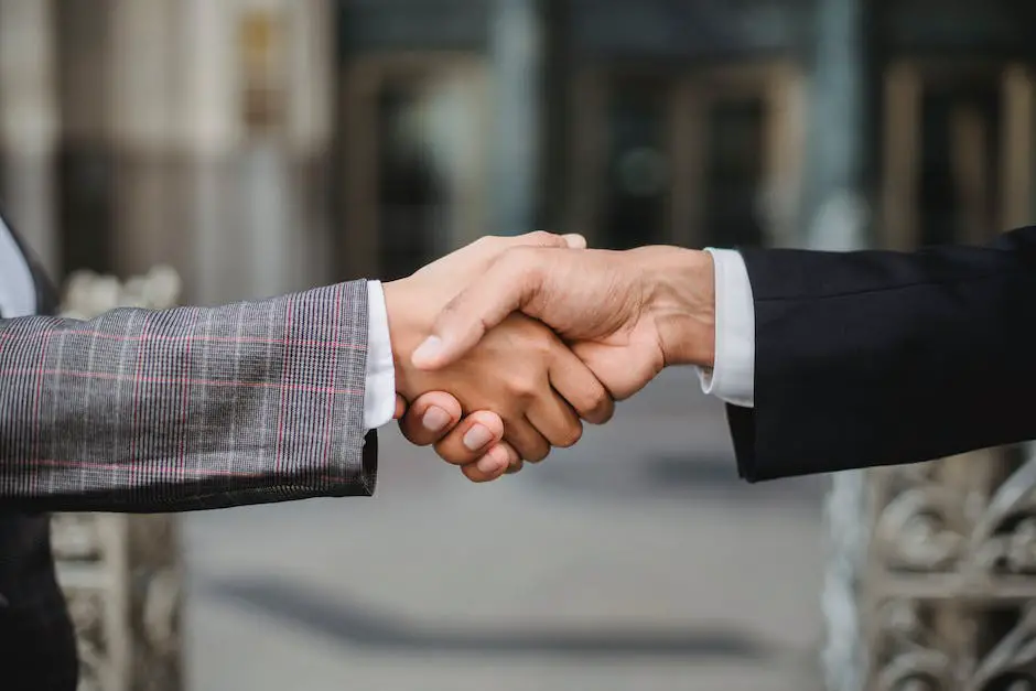 Two people shaking hands in a business networking event